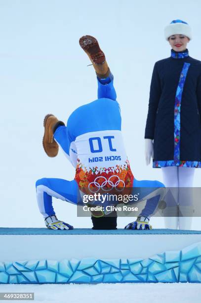 Bronze medalist Christof Innerhofer of Italy celebrates during the flower ceremony for the Alpine Skiing Men's Super Combined Downhill on day 7 of...