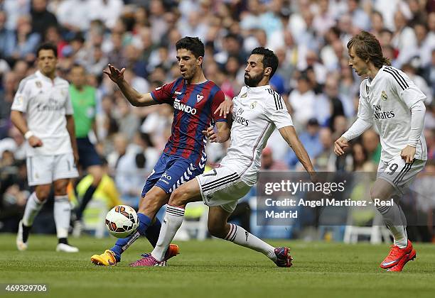 Alvaro Arbeloa of Real Madrid competes for the ball with Didac Vila of Eibar during the La Liga match between Real Madrid CF and Eibar at Estadio...