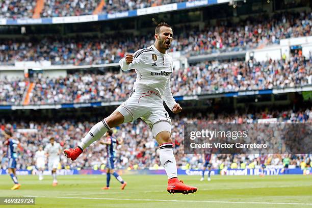 Jese Rodriguez of Real Madrid celebrates after scoring his team's third goal during the La Liga match between Real Madrid CF and Eibar at Estadio...