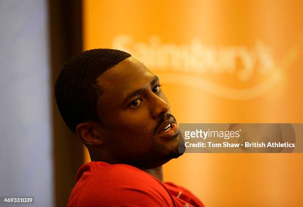 David Oliver of the USA talks to the press during the press conference prior to the Sainsbury's Indoor Grand Prix at the Crowne Plaza Hotel on...