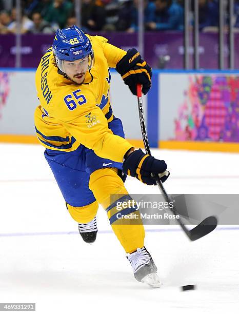 Erik Karlsson of Sweden shoots in the second period against Switzerland during the Men's Ice Hockey Preliminary Round Group C game on day seven of...