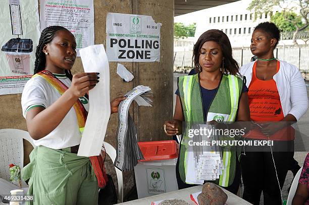 Officials of Independent National Electoral Commission count ballots during gubernatorial and local assembly elections in Lagos on April 11, 2015....