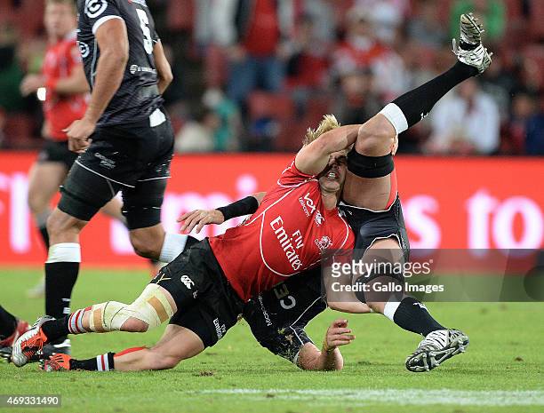 Mouritz Botha of the Sharks gets tackled by Faf de Klerk of the Lions during the Super Rugby Round 9 match between Emirates Lions and Cell C Sharks...