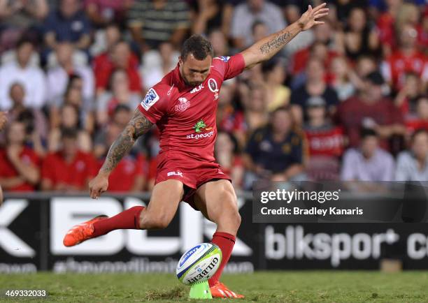 Quade Cooper of the Reds takes a penalty shot at goal during the Super Rugby trial match between the Queensland Reds and the Melbourne Rebels at...