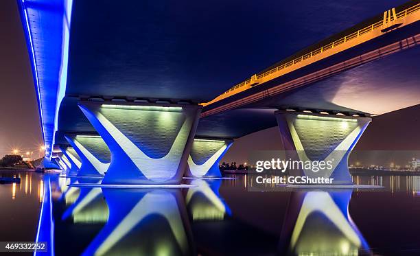garhoud bridge in dubai with festival city in the background - luxary stock pictures, royalty-free photos & images