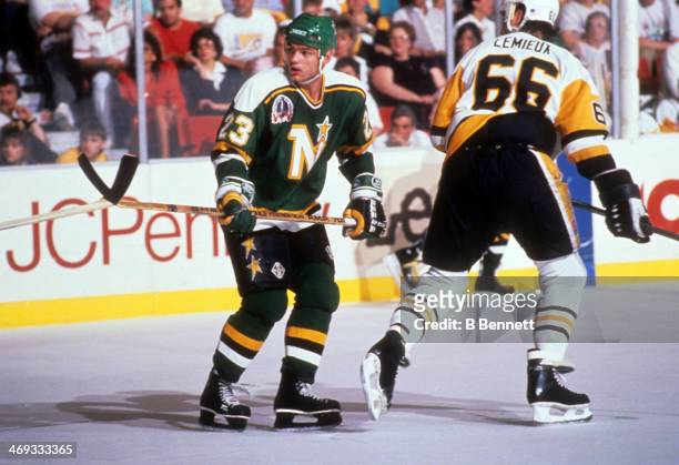 Brian Bellows of the Minnesota North Stars defends against Mario Lemieux of the Pittsburgh Penguins during the 1991 Stanley Cup Finals on May, 1991...