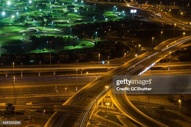 golf course alongside expressway - lamp shade stockfoto's en -beelden