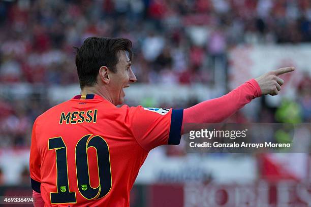 Lionel Messi of FC Barcelona celebrates scoring their opening goal during the La Liga match between Sevilla FC and FC Barcelona at Estadio Ramon...
