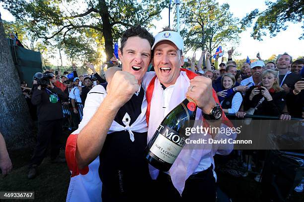 Justin Rose and Ian Poulter of England and the European Team celebrate the famous victory after the Singles Matches for The 39th Ryder Cup at Medinah...