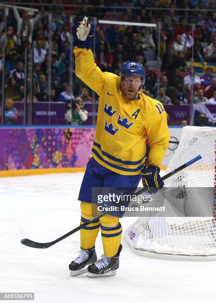 Daniel Alfredsson of Sweden celebrates after a goal in the third period against Switzerland during the Men's Ice Hockey Preliminary Round Group C...
