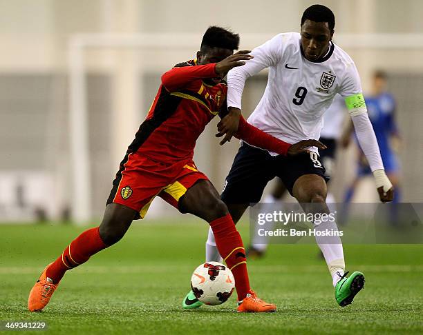 Joel Kalonji-Kalonji of Belgium holds off pressure from Kaylen Hinds of England during a U16 International match between England and Belgium at St...