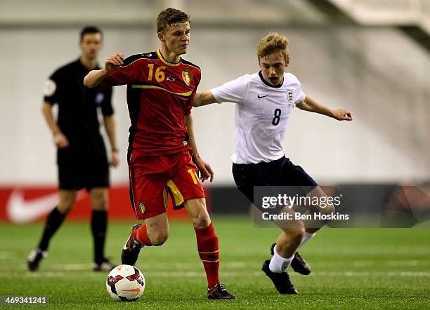 Matisse Thuys of Belgium holds off pressure from Tom Davies of England during a U16 International match between England and Belgium at St Georges...