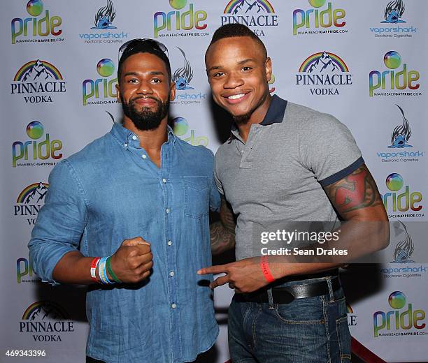 Wrestler Darren Young , the first American professional wrestler to come out as gay, poses with Derrick Gordon, the first American college basketball...