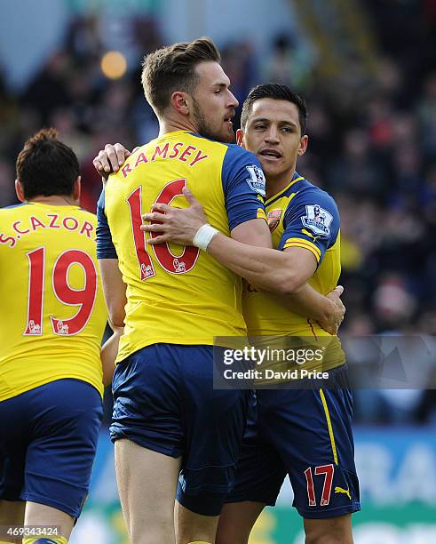 Aaron Ramsey of Arsenal celebrates scoring the only goal of the game with Alexis Sanchez during the Barclays Premier League match between Burnley and...