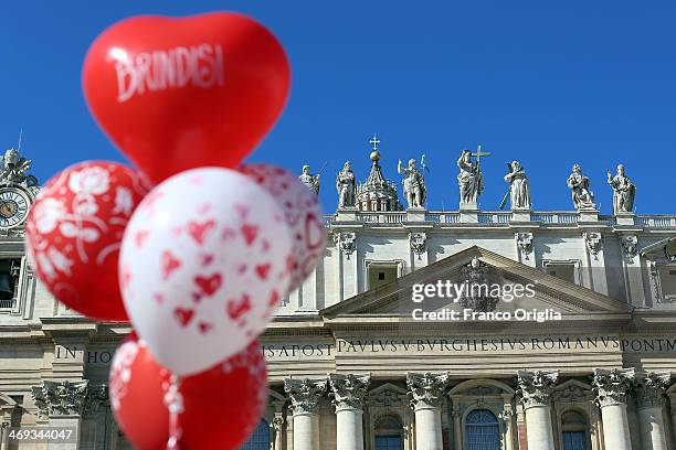 View of St. Peter's Basilica framed by balloons during the meeting of Pope Francis with engaged couples from all over the world gathered today, on...