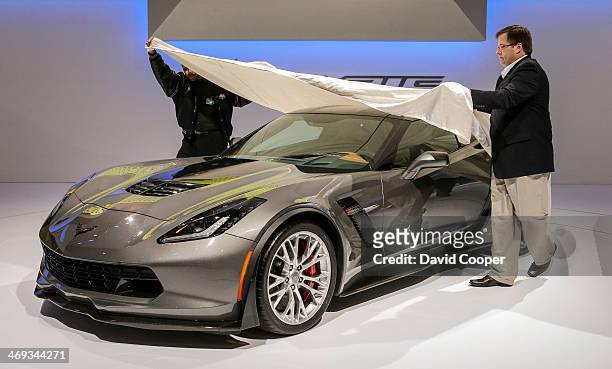 Chevrolet Corvette Z06 get covered up before the big reveal during the media day at the Canadian International Auto Show in Toronto February 13, 2014.