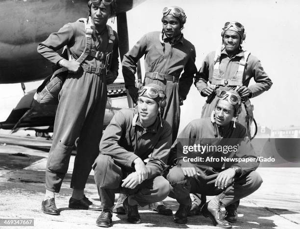 Photograph of Tuskegee airmen during World War 2, with fighter planes, Tuskegee, Alabama, 1944.