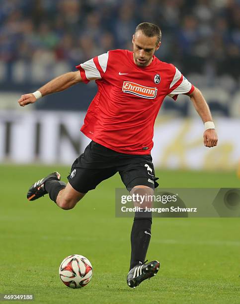 Pavel Krmas of Freiburg kicks the ball during the Bundesliga match between Schalke 04 and SC Freiburg at Veltins Arena on April 11, 2015 in...