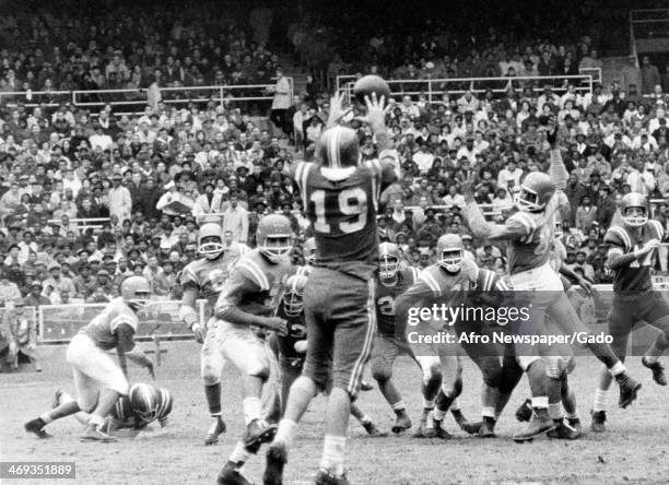 Football players during a football game, 1970.