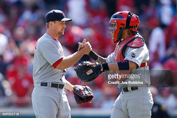 Trevor Rosenthal and Yadier Molina of the St. Louis Cardinals celebrate after the final out of the ninth inning after the game against the Cincinnati...