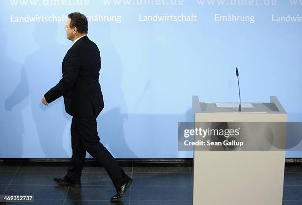 German Agriculture and Consumer Protection Minister Hans-Peter Friedrich departs after announcing his resignation to the media on February 14, 2014...