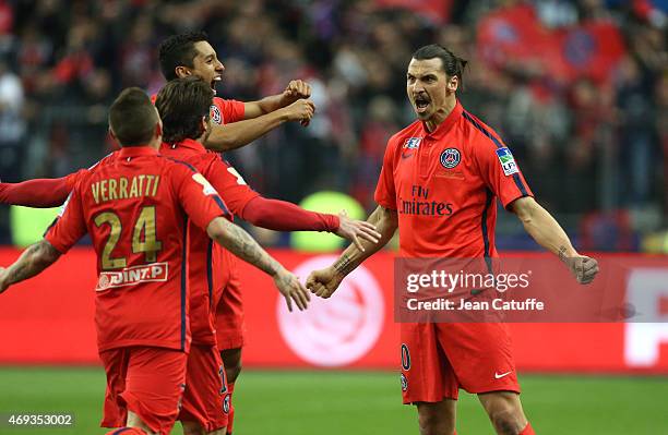 Zlatan Ibrahimovic of PSG celebrates scoring his second goal with Marquinhos of PSG and teammates during the French League Cup final between Paris...