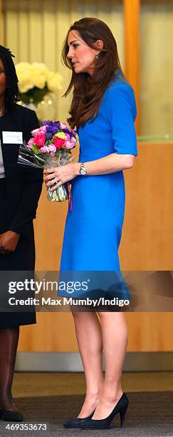 Catherine, Duchess of Cambridge leaves Northolt High School after officially opening The ICAP Art Room on February 14, 2014 in Ealing, England.