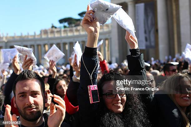 Engaged couples from all over the world gathered today, on the feast of St. Valentine, in St. Peter's Square hold a cushion for wedding rings...