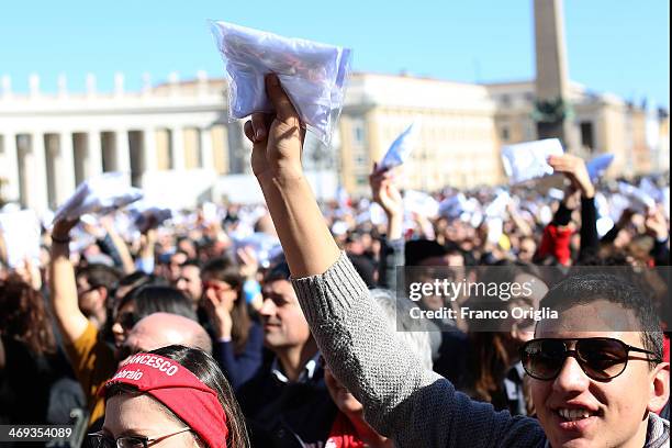 Engaged couples from all over the world gathered today, on the feast of St. Valentine, in St. Peter's Square hold a cushion for wedding rings...