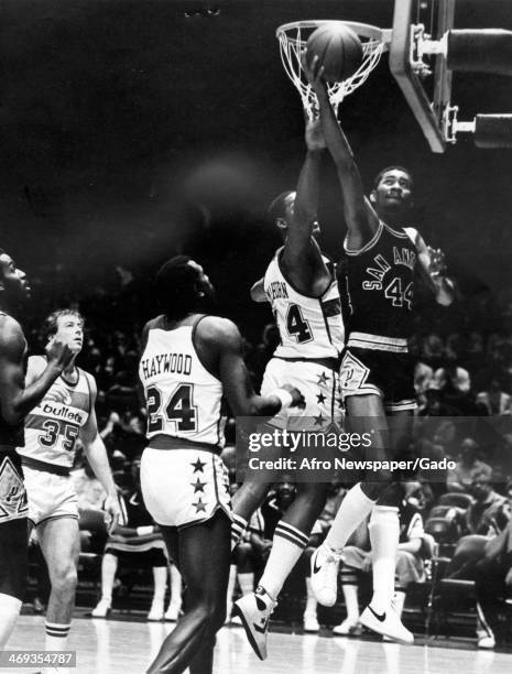 Photograph of a basketball match of the San Antonio Spurs vs Washington Bullets, with San Antonio's George Gervin, the 'Iceman', scoring a point,...