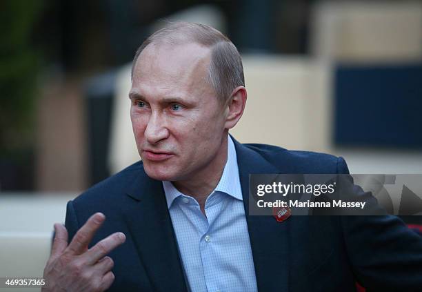 Russian President Vladimir Putin visits USA House in the Olympic Village on February 14, 2014 in Sochi, Russia.
