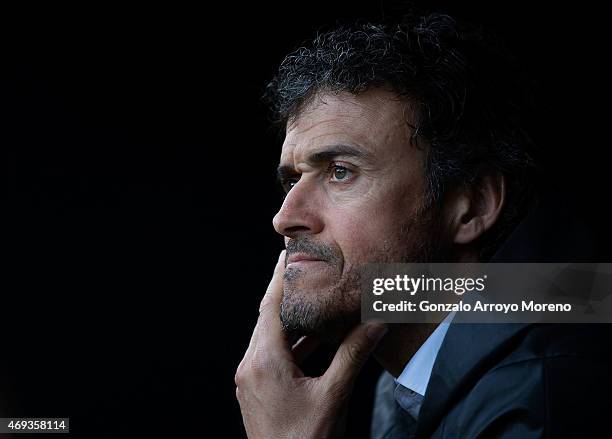 Head coach Luis Enrique Martinez of FC Barcelona reacts sitted on the bench prior to start the La Liga match between Sevilla FC and FC Barcelona at...