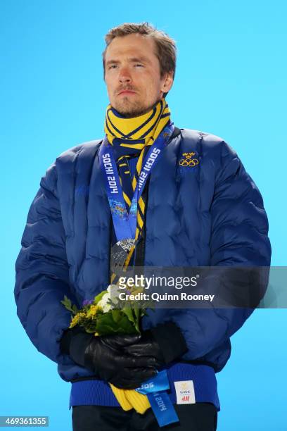 Silver medalist Johan Olsson of Sweden celebrates during the medal for the Cross Country Men's 15km Classic event on day 7 of the Sochi 2014 Winter...