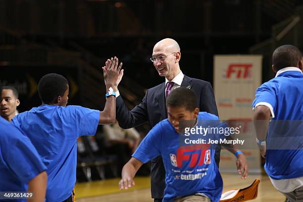 Commissioner Adam Silver high fives a kid during a NBA FIT All-Star Youth Celebration as part of 2014 NBA All-Star Jam Session at the Ernest N....