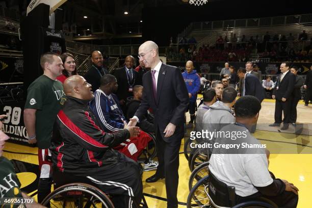 Commissioner Adam Silver shakes hands during the NBA/WNBA Wheelchair All-Star Game as part of 2014 NBA All-Star Jam Session at the Ernest N. Morial...