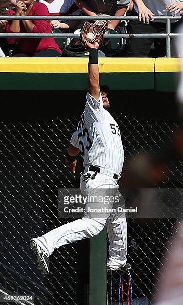 Melky Cabrera of the Chicago White Sox makes a leaping catch on a ball hit by Joe Mauer of the Minnesota Twins in the 5th inning at U.S. Cellular...