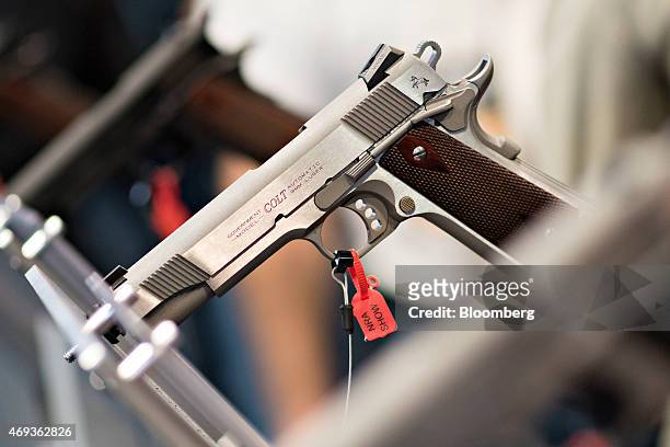 Colt 9mm pistol sits on display in the Colt's Manufacturing Co. Booth on the exhibition floor of the 144th National Rifle Association Annual Meetings...
