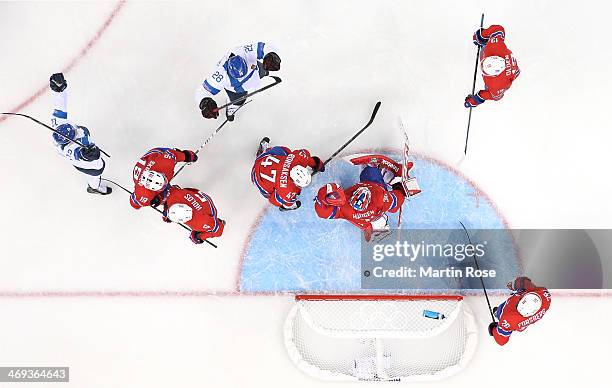 Lauri Korpikoski of Finland celebrates after scoring against Lars Haugen of Norway in the first period during the Men's Ice Hockey Preliminary Round...