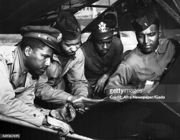 Field Artillery Officers and Tuskegee Airmen Elwood A Smith, Scott K Cleage, Sterling K Jackson and Wendel Long complete pre flight checks on an...