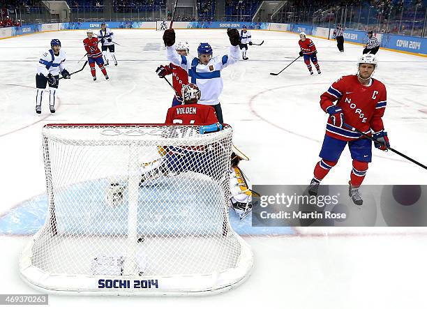 Lauri Korpikoski of Finland celebrates after scoring in the second period against Lars Haugen of Norway during the Men's Ice Hockey Preliminary Round...