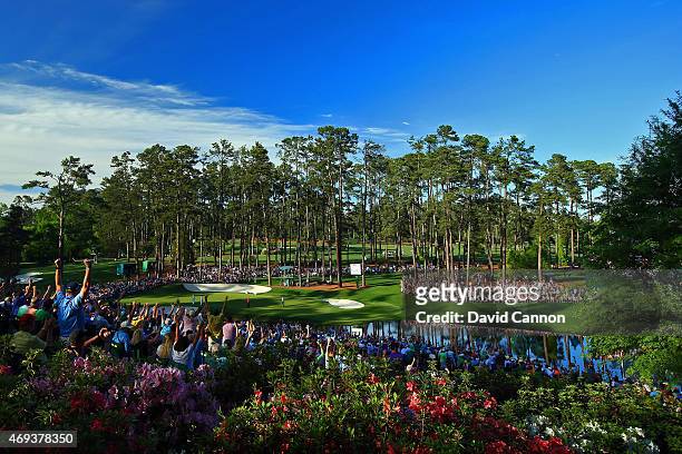 Phil Mickelson of the United States celebrates a birdie putt on the 16th green during the third round of the 2015 Masters Tournament at Augusta...