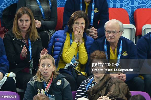 King Carl XVI Gustaf of Sweden and Queen Silvia of Sweden react as Alexander Majorov of Sweden performs during the Figure Skating Men's Free Skating...