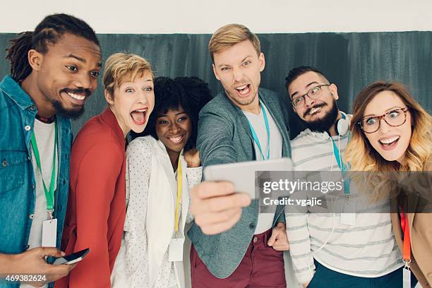 creative young people making group selfie. - men selfie wide stock pictures, royalty-free photos & images