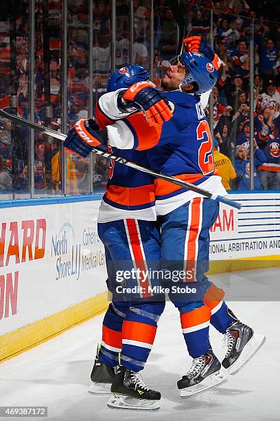 Eric Boulton of the New York Islanders is congratulated by teammate Tyler Kennedy after scoring a third period goal against the Columbus Blue Jackets...