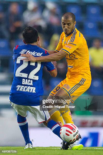 Rafael Baca of Cruz Azul fights for the ball with Guido Pizarro of Tigres during a match between Cruz Azul and Tigres UANL as part of 13th round...