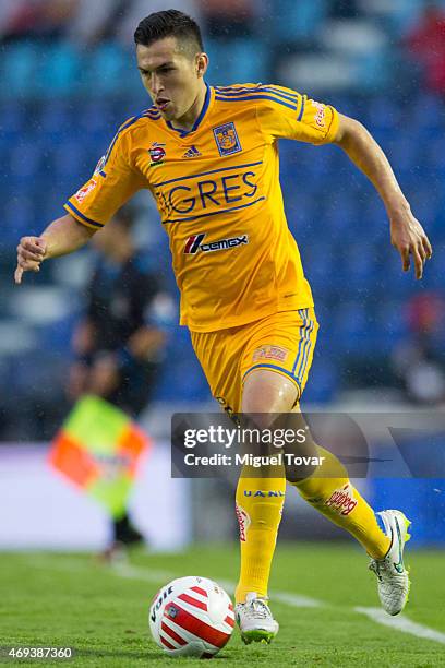 Jorge Torres of Tigres drives the ball during a match between Cruz Azul and Tigres UANL as part of 13th round Clausura 2015 Liga MX at Azul Stadium...