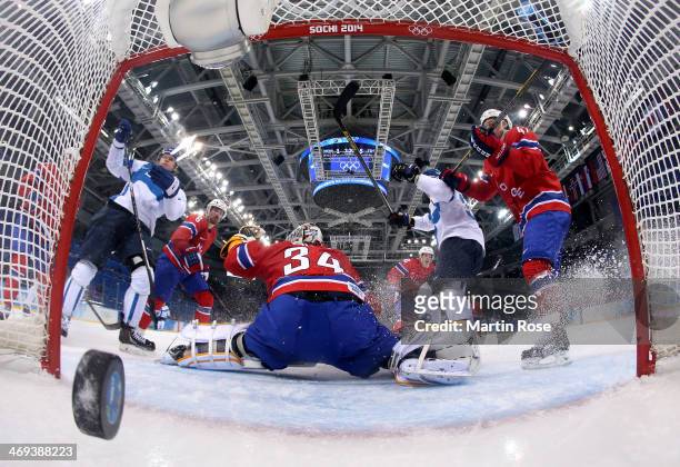 Olli Maatta of Finland scores against Lars Volden of Norway in the third period during the Men's Ice Hockey Preliminary Round Group B game on day...