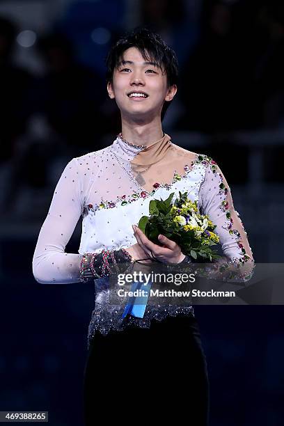 Yuzuru Hanyu of Japan celebrates after winning the gold medal in the Figure Skating Men's Free Skating on day seven of the Sochi 2014 Winter Olympics...