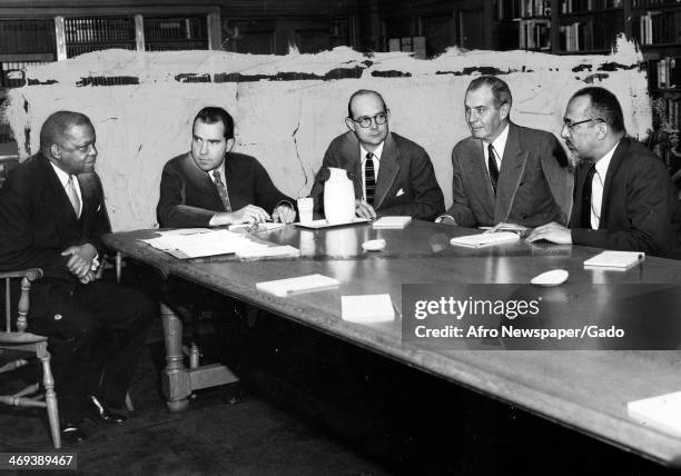 Head and shoulders portrait of Vice President Richard Nixon, heading a panel discussion at the Howard University of Law, with, from left, George M...