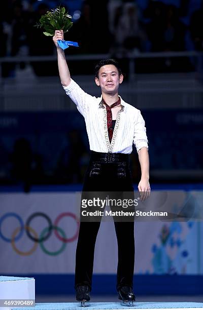 Denis Ten of Kazakhstan poses after winning the bronze medal in the Figure Skating Men's Free Skating on day seven of the Sochi 2014 Winter Olympics...